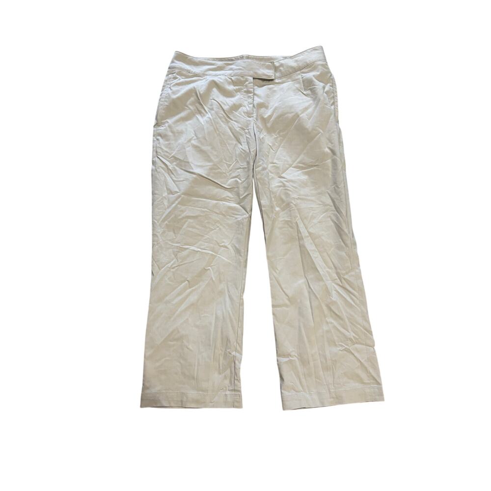 Nike tan M capri golf pants with leg zippers to create more flare at hemline euc